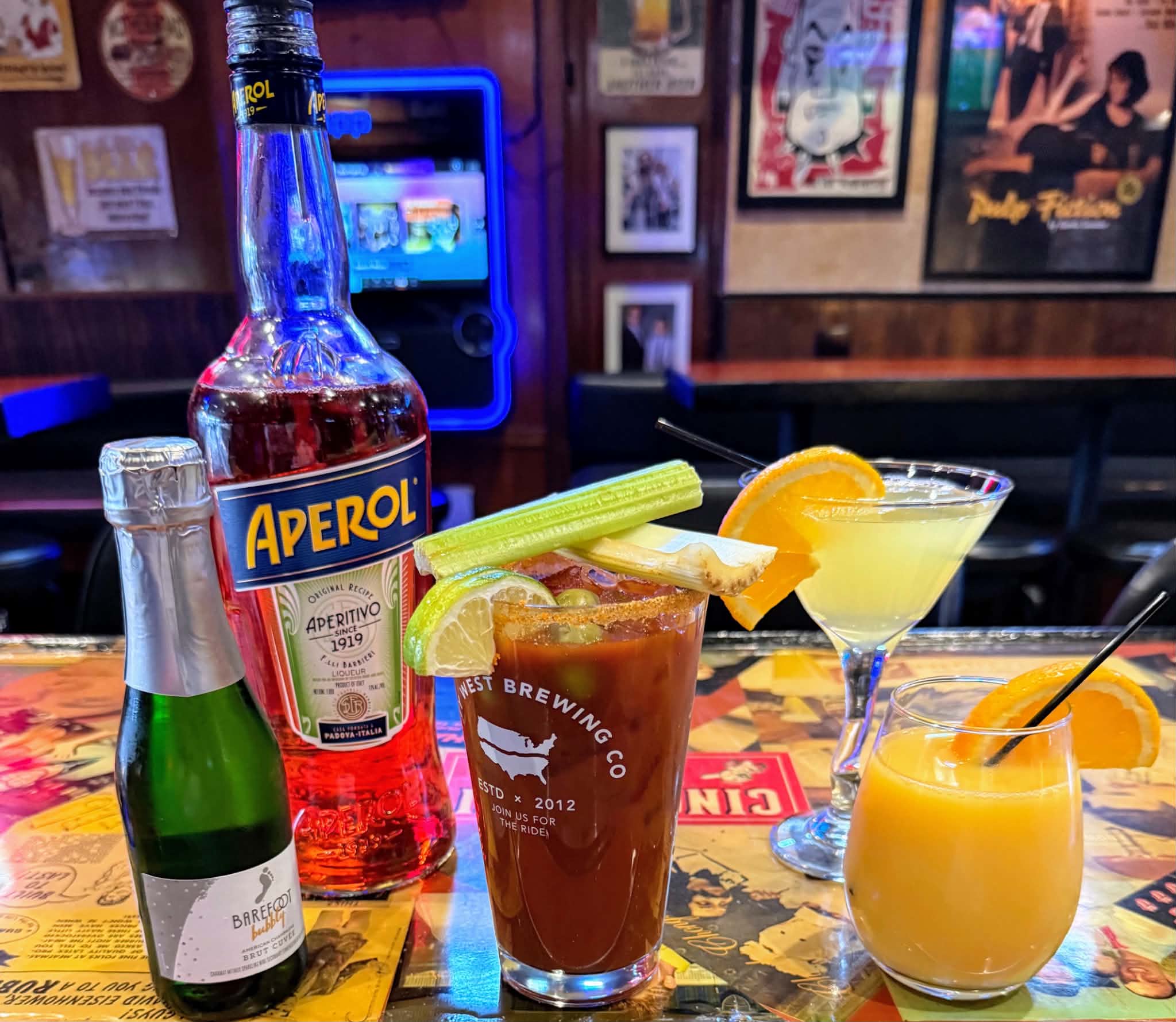 A lineup of cocktails including a Bloody Mary and mimosa