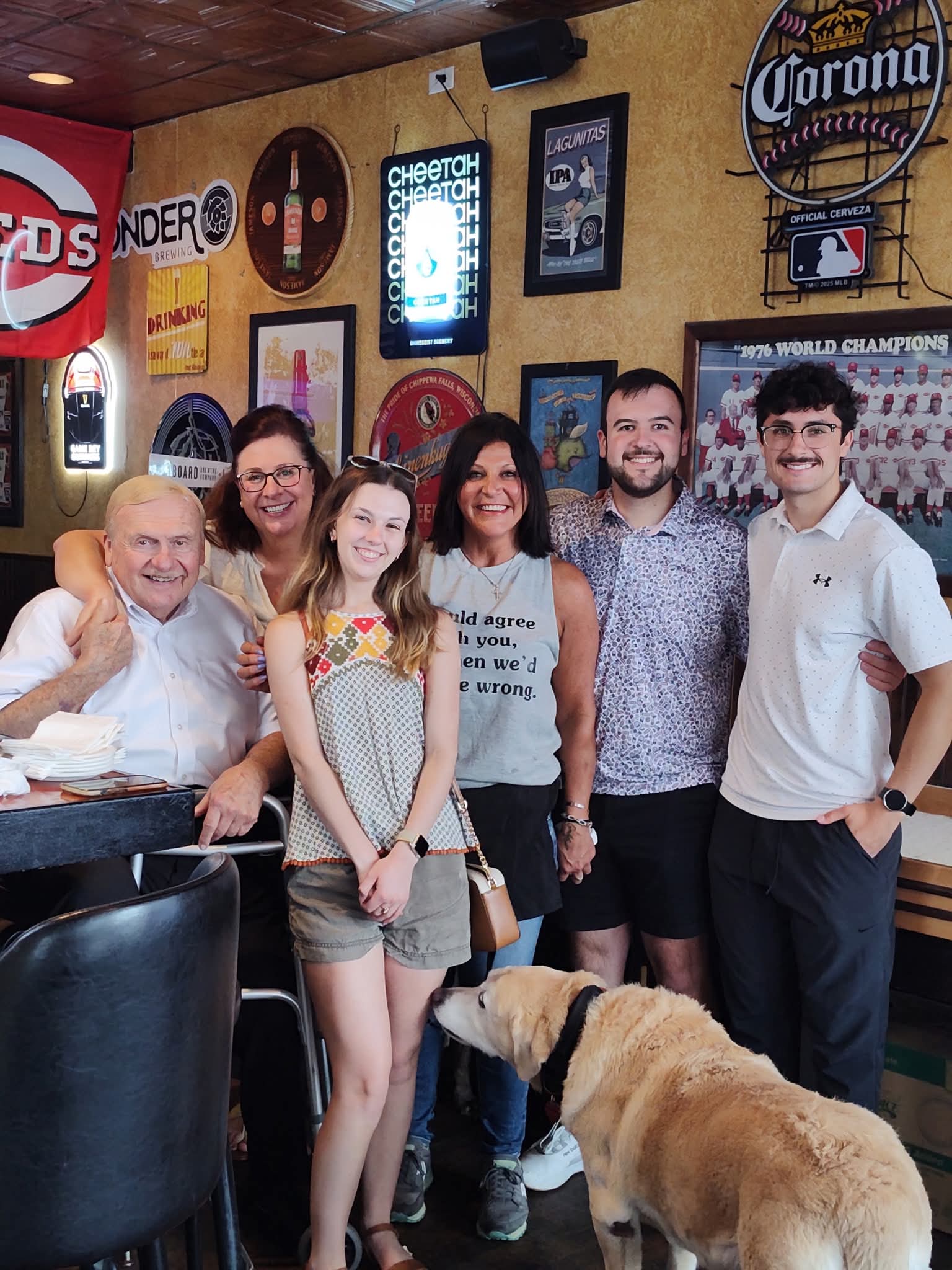 A family and their dog gathered inside the bar