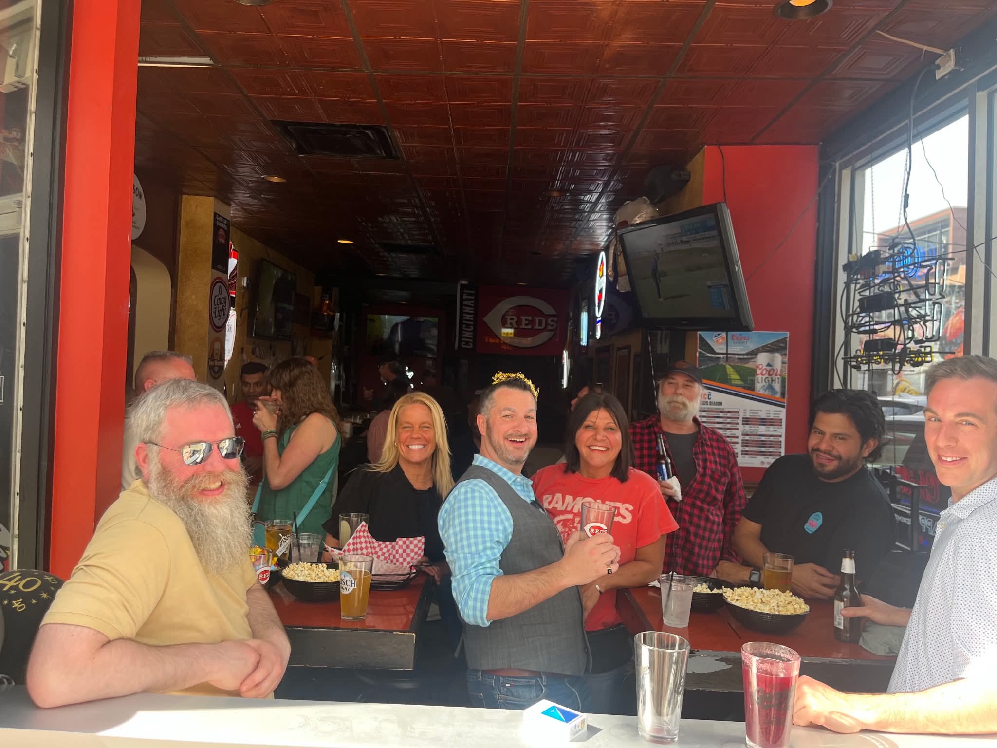 Friends gathered on the patio in Bengals orange